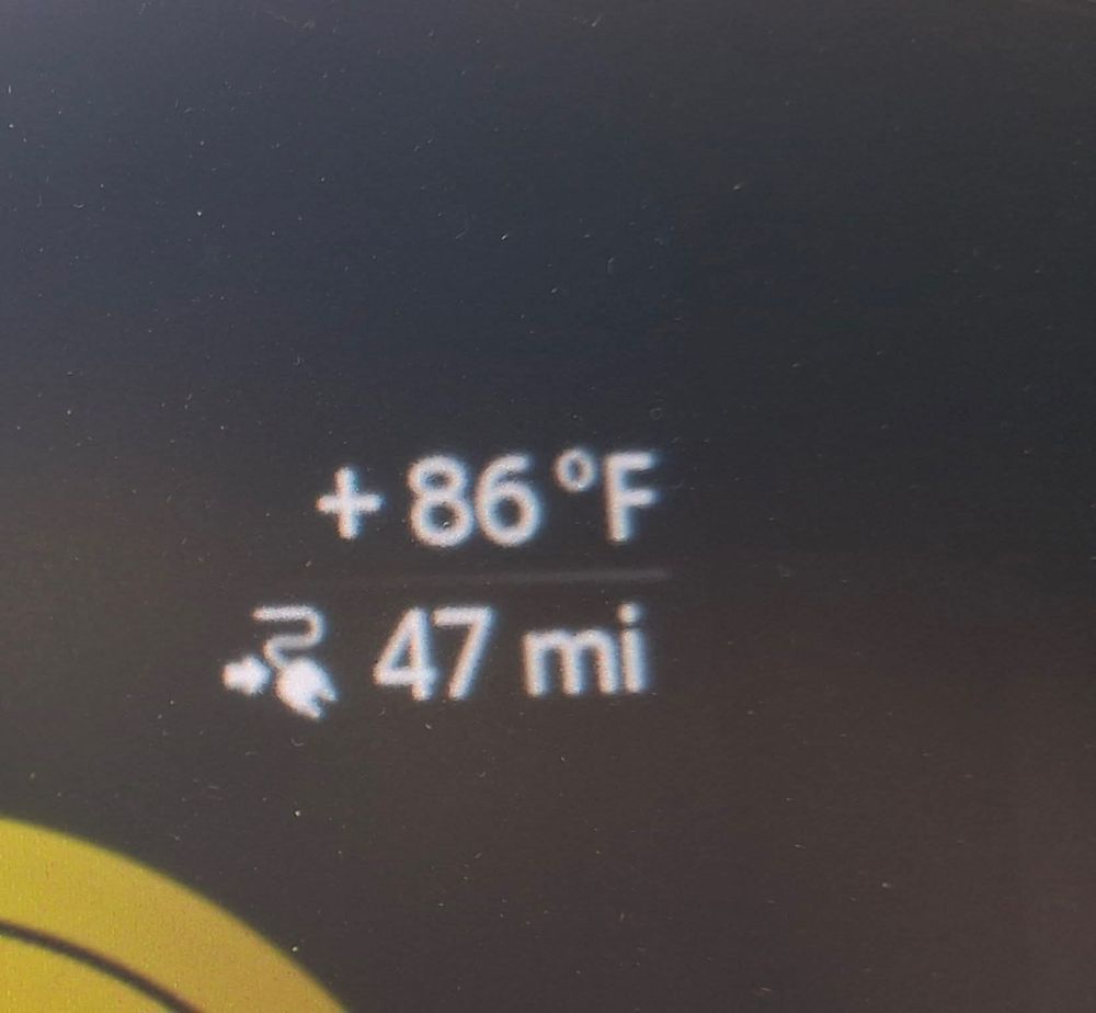 Dashboard temperature and remaining miles reading 86° and 47 mi.