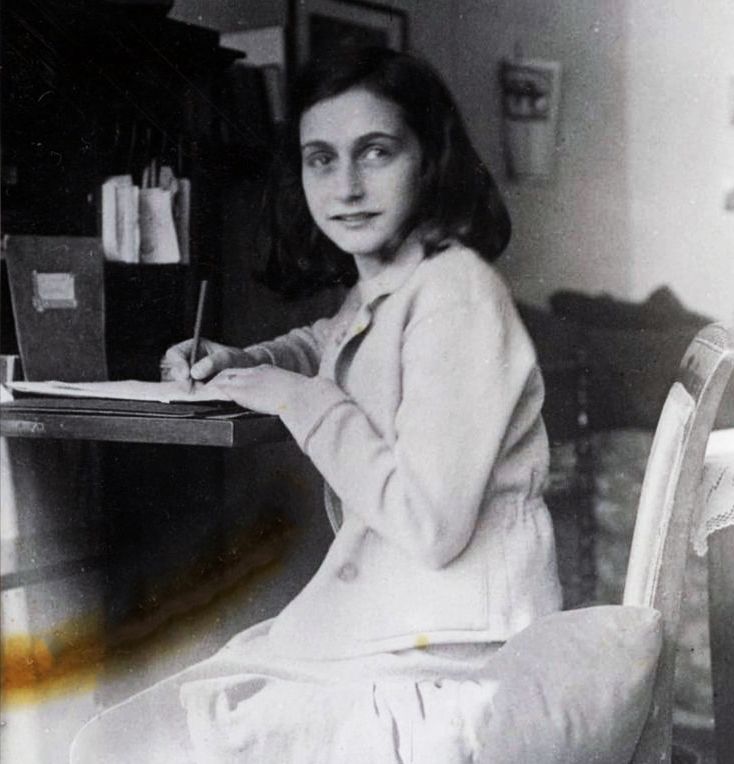 August 1, 1944: Anne Frank writes her last diary entry. Three days later, on August 4, 1944, the Secret Annex was raided by the Gestapo following a tip from an unknown informant. Anne and the seven others in hiding were arrested and were deported to #Westerbork transit camp from where the Frank family were send to #Auschwitz and Anne and her sister Margot later were transferred to Bergen-belsen where they both die in early 1945. Photo: Anne Frank writing.