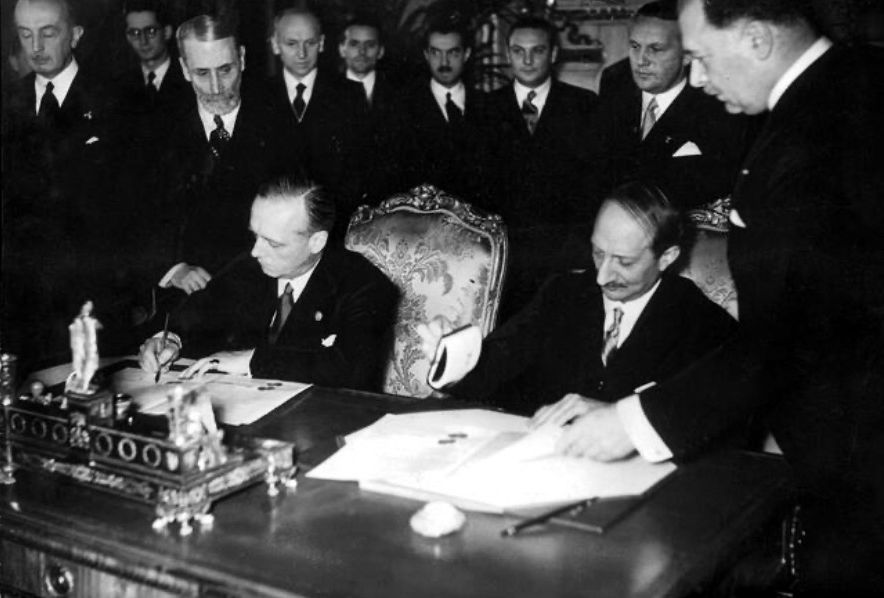 Foreign Ministers Joachim von Ribbentrop and Georges Bonnet signed a treaty in Paris by which Germany and France guaranteed the inviolability of one another's borders and agreed to engage in mutual consultation to resolve all disputes peacefully. Germany invaded France, the Netherlands, Belgium and Luxembourger 10 May 1940.
Ribbentrop was convicted on four counts at the Nuremberg trials.: crimes against peace, deliberately planning a war of aggression, committing war crimes, and crimes against humanity. 
According to the judgment, Ribbentrop was actively involved in planning the Anschluss, as well as the invasions of Czechoslovakia and Poland. He was also deeply involved in the "final solution"; as early as 1942 he had ordered German diplomats in Axis countries to hasten the process of sending Jews to death camps in the east. He supported the lynching of Allied airmen shot down over Germany, and helped to cover up the 1945 murder of Major-General Gustave Mesny, a French officer being held as a prisoner-of-war. He was held directly responsible for atrocities which took place in Denmark and Vichy France
Even in prison, Ribbentrop remained loyal to Hitler: "Even with all I know, if in this cell Hitler should come to me and say 'do this!', I would still do it."
On 16 October 1946, Ribbentrop became the first of those sentenced to death at Nuremberg to be hanged.
Photo: Joachim von Ribbentrop (l) and Georges Bonnet (r) signed the treaty in Paris, 1938.
