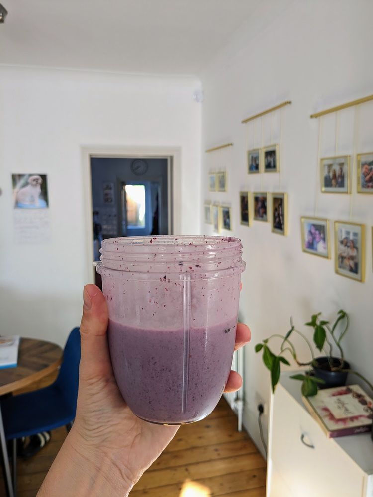 A purple milkshake, made with blueberries and banana.