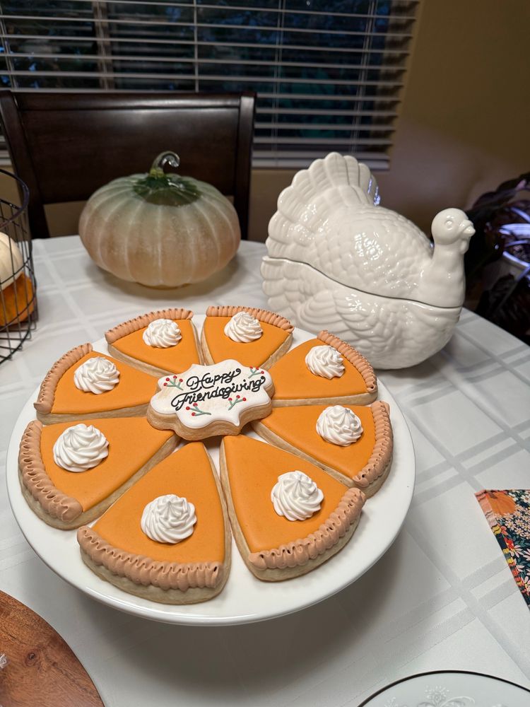 Sugar cookies decorated to look like pumpkin pie. 