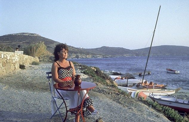 The fabulous Pauline Collins playing the title role in Willy Russell's Shirley Valentine. Sat at a table for 1 with her glass of the local wine, on the edge of the sea.