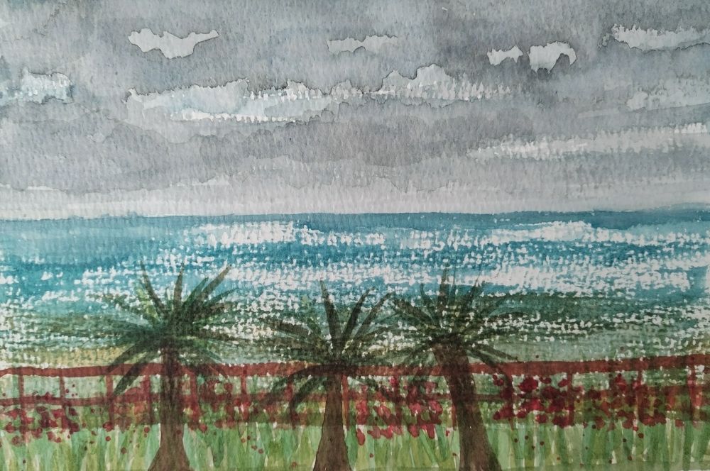 A watercolour painting of the sea at Hastings, with grey skies, a few sparkles of light on the turquoise waves, and three mini palm trees and some border plants with red flowers on the foreground.