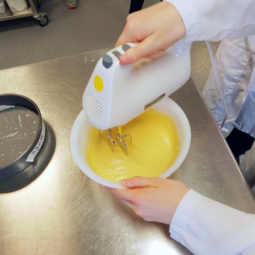 Student baking a cake