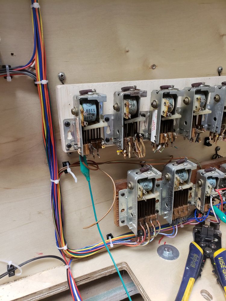 A shot of the point relays (on top) and score select relays (larger, on bottom) for the electromechanical pinball machine; Voyager.