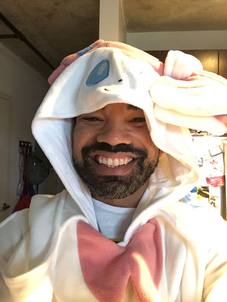 Me wearing a v large Sylveon kigurumi
