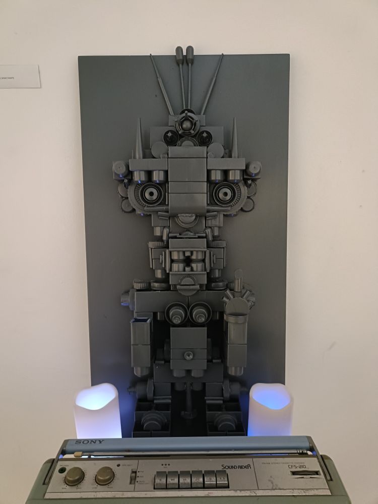 Duplo robot flipping the bird by Christopher Eccles aka Coloured Taped Matter on display at The Old Ambulance Station in Namba.