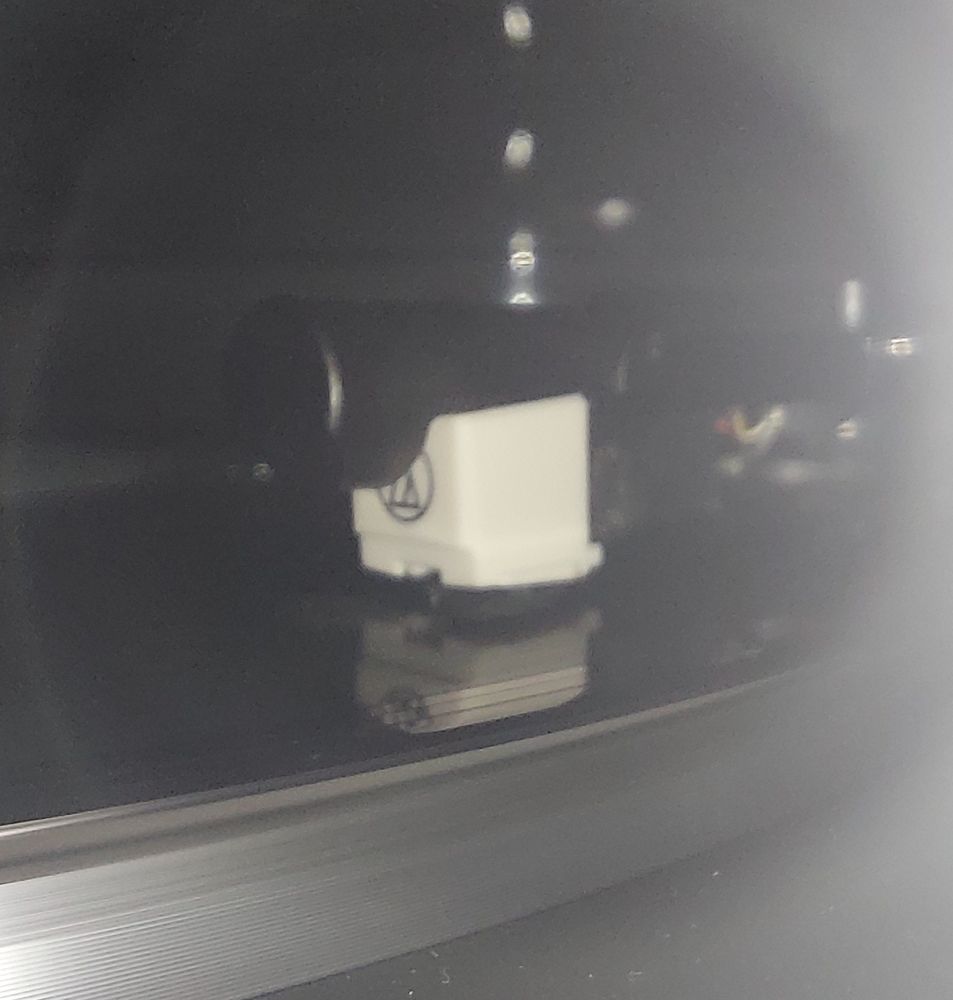 Close up shot of a record player with a replacement cartridge