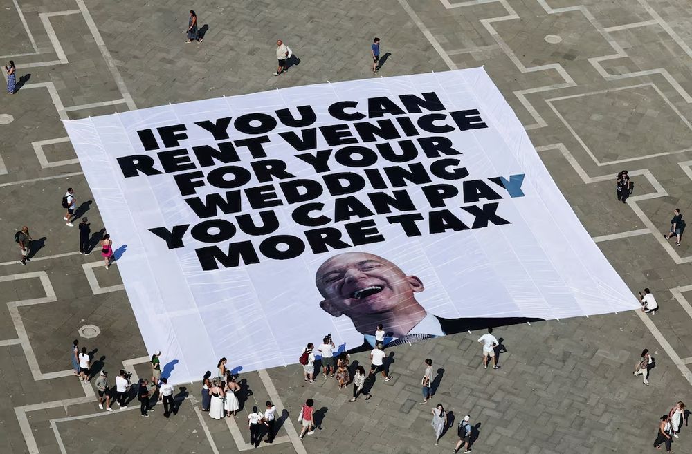 Aerial photo of Venice, Italy, where protestors unveiled a large banner with a picture of Amazon chief Jeff Bezos and text that reads 