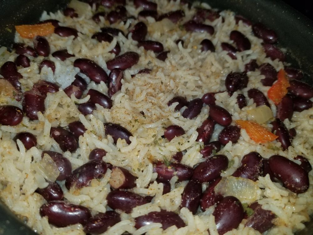 Rice, beans, onions, and peppers  in a pot