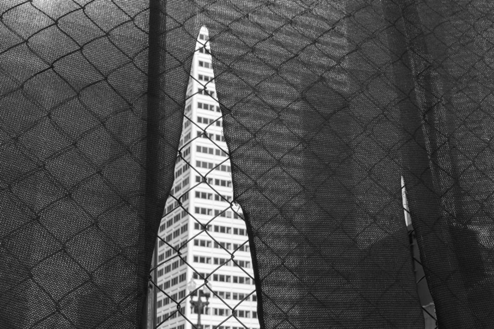Chicago skyscraper from Union Station through construction site fence