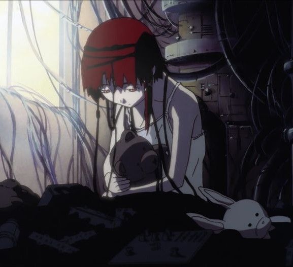 lain iwakura, she sat by a window in a low lit room surrounded by wires as she hugs a teddy bear with a dejected expression. 