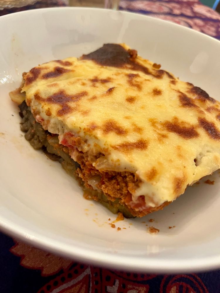 A piece of moussaka. The lamb, the eggplant, and potato layers now visible.