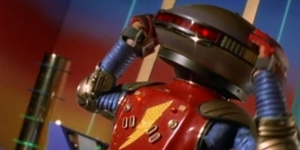 Aloha 5, a robot from mighty morphing power rangers with hands in his head in distress 