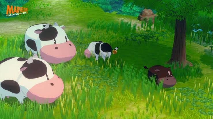 Video game cows grazing in a field.