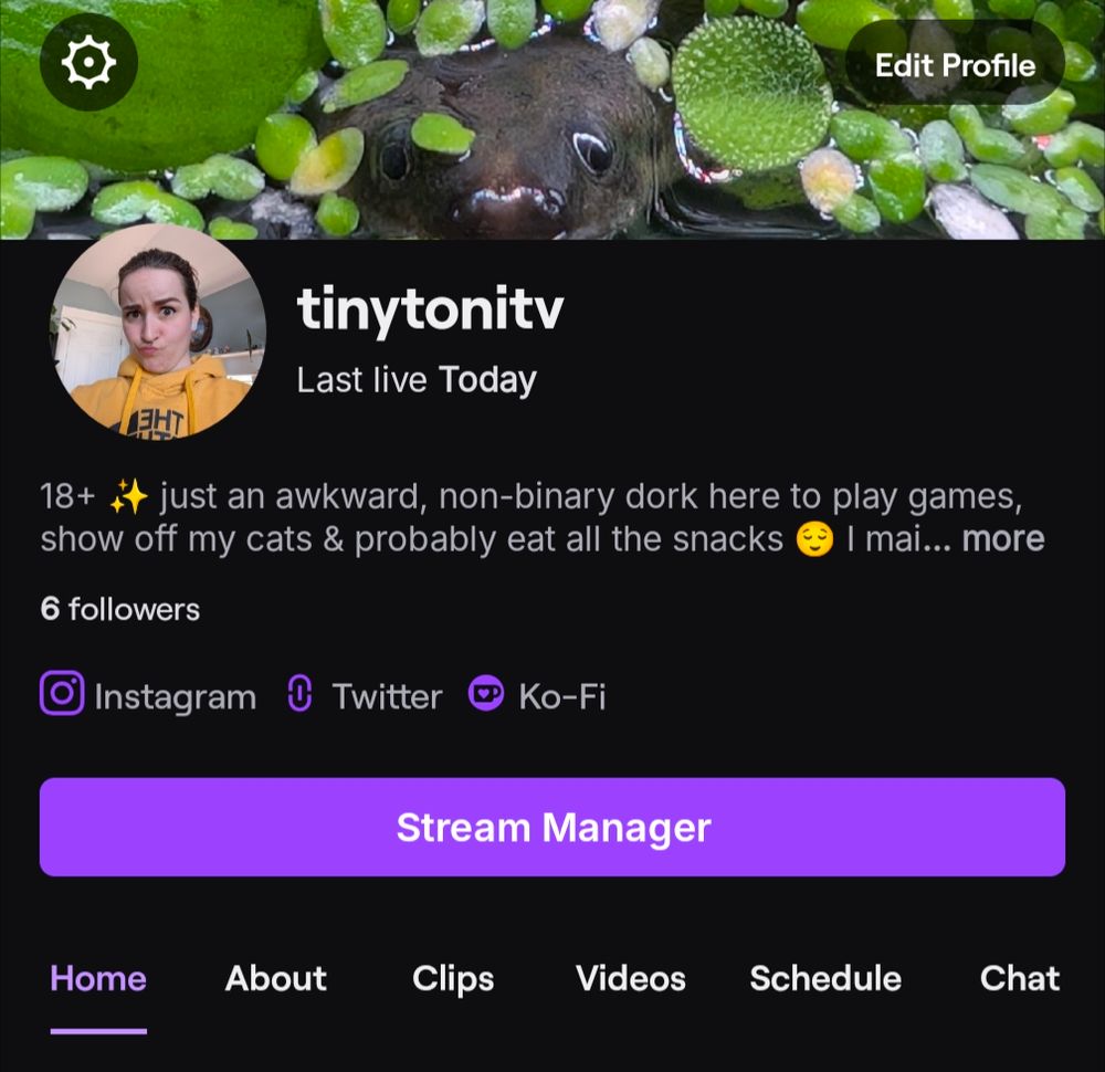 A screenshot of Toni's Twitch profile. Their username is TinyToniTV on there

Screenshot has a black background with purple button accents. Header photo is a frog leaking it's head out around aquarium plants, profile photo is Toni making a silly face with their hair pulled into a ponytail & wearing a yellow hoodie