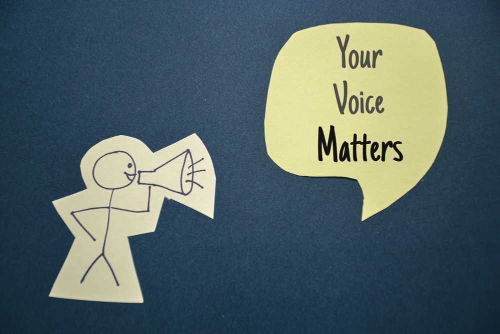 your voice matters stick figure holding megaphone
