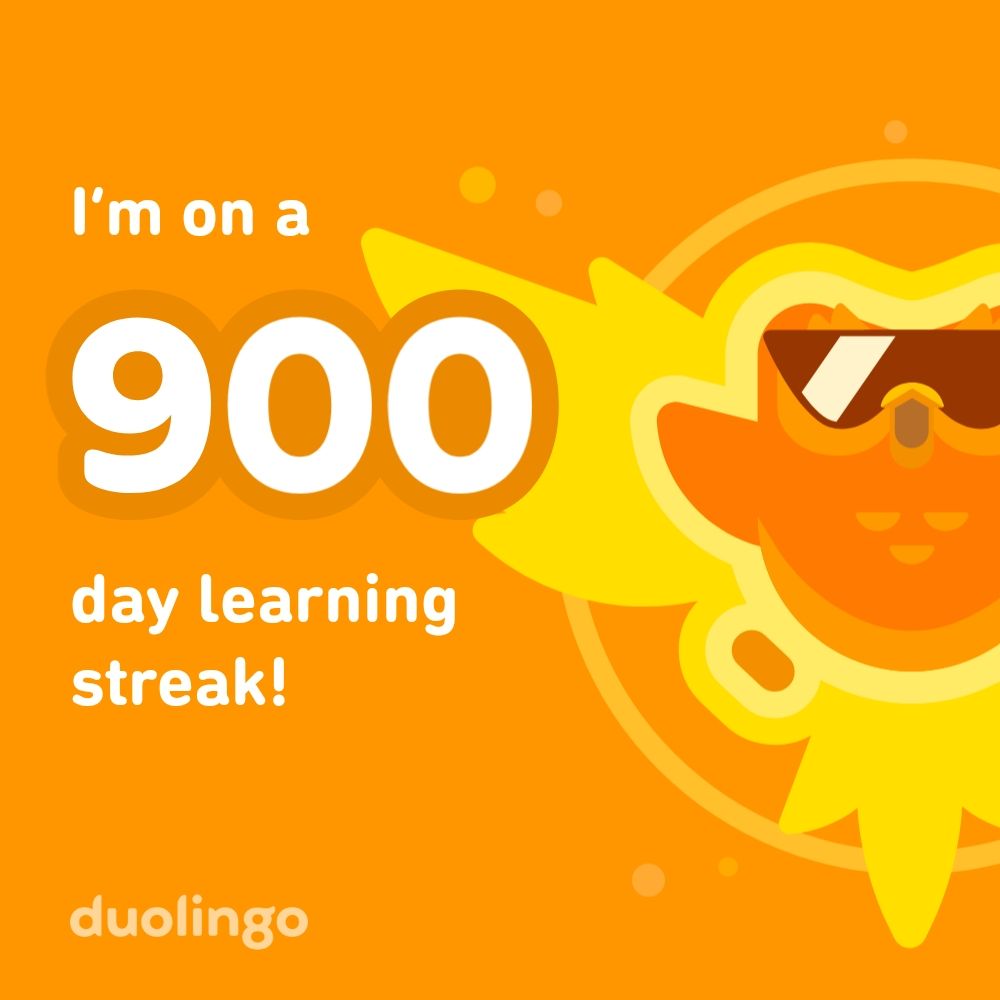 Orange and yellow image with the Duolingo own on the ride side wearing cool sun glasses that has the text to the Left" I'm on a 900 day learning streak" 