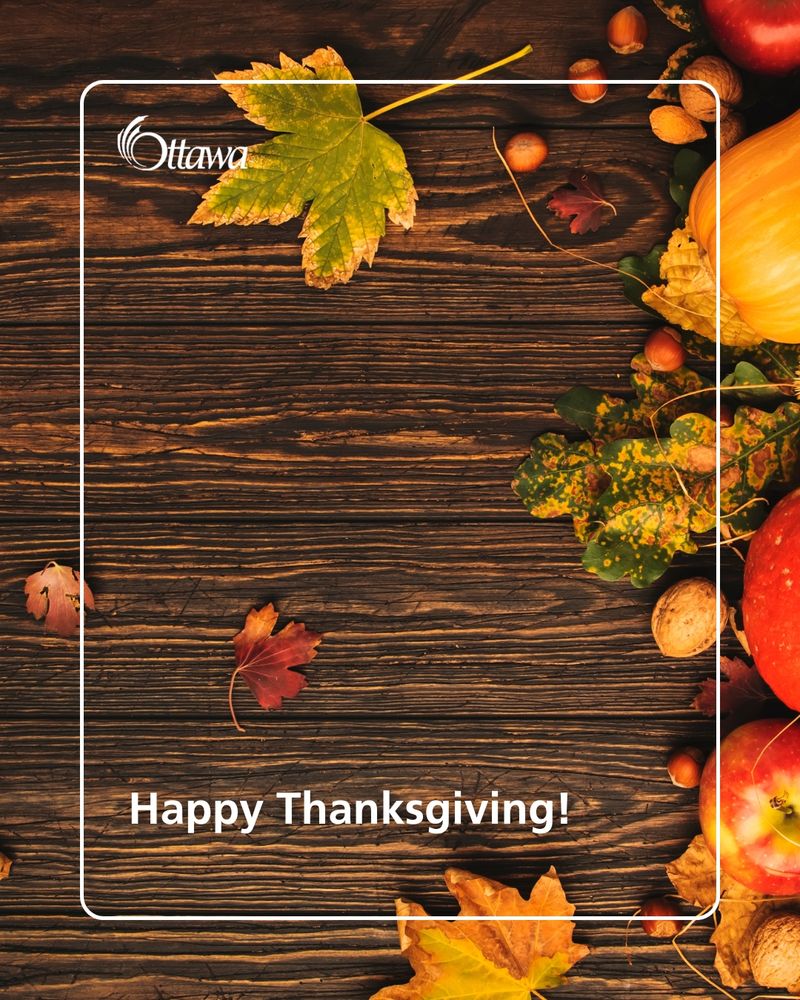 Various pumpkins and seasonal vegetables line the top and sides of the graphic. 
Happy Thanksgiving is written in the bottom left corner.