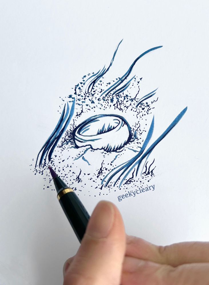 Traditional ink illustration of The Ring from The Lord Of The Rings at the bottom of the riverbed surrounded by sand and seaweed. The drawing uses a limited black a blue color palette. A hand holding a brush pen sits above it. Art by geekycleary.
