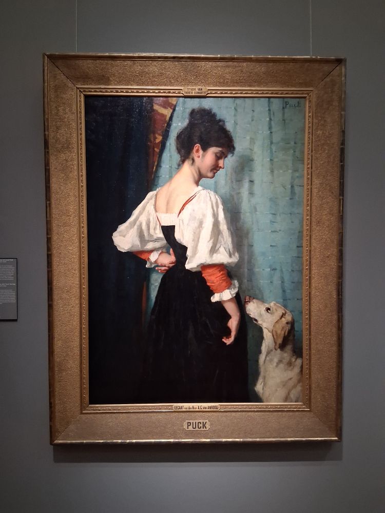 A picture of a painting named "Young Italian Woman, with 'Puck' the Dog" by Thérèse Schwartze (1851 - 1918)

The painting (oil on canvas) is described as follows:

"Known as Fortunata, this woman was one of the many professional Italian models working in Paris in the late 19th century. Schwartze started this painting while sojourning there in 1884 and exhibited it a year later in Amsterdam, having added the dog in the meanwhile. For a young female artist at the time, studying in Paris was as unconventional as pursuing a career as an artist. However, Schwartze pressed on and became a highly successful portraitist." 
