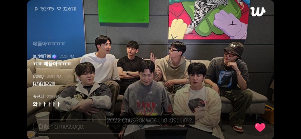 A screenshot from the beginning of the first ot7 bts weverse live. The members are talking about how long ago their last livestream as a group was, and Namjoon says that the last one has been for Chuseok 2022 :') Yoongi, Jimin and Jinnie are sitting on the floor (front row) and all are looking down. Sitting behind them on a sofa (in front of their album cover artworks) are Namjoon, Tae, JK and Hobi. Joonie is talking and the others look at him, and JK is holding up a number with his fingers. 
It's a screenshot from the beginning of the live and I still cannot believe that the notifications were actually fast this time and I didn't miss anything, the world is healing <3