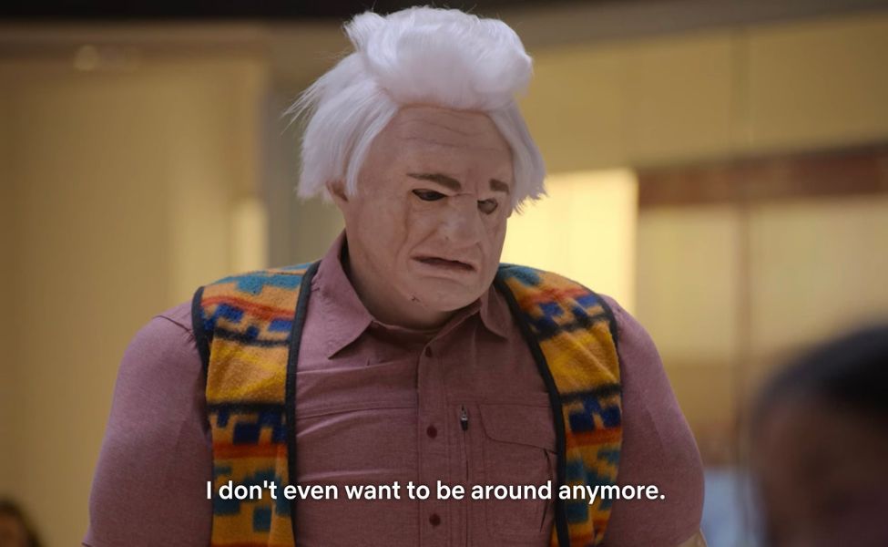 A man in a bulky costume with a blank, dejected expression says “I don’t even want to be around anymore.” (ie the Karl Havoc meme)