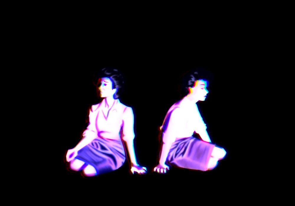 two tegans sitting in a void beside each other while they both look away from each other