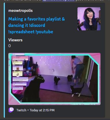 A screenshot of a discord message showing the stream title and thumbnail for a meowtropolis stream. The title is "Making a favorites playlist and dancing it !discord !spreadsheet !youtube" and the thumbnail shows meowtropolis in the background leaned over to possibly pet one of the three cats around her on the floor. There is a fourth cat up close to the camera, turned back like she is about to jump.