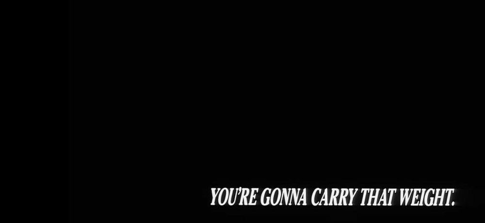 Cowboy Bebop end title card, in white italics at the bottom right of an otherwise all-black screen: "YOU'RE GONNA CARRY THAT WEIGHT."
