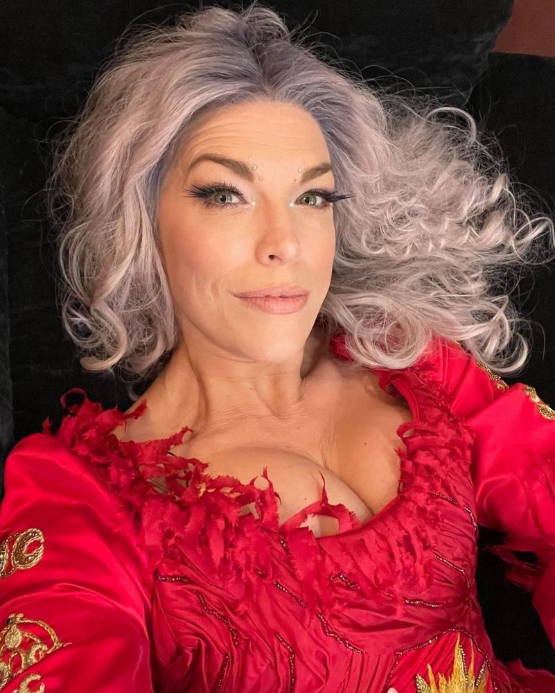 Hannah Waddingham selfie in her Hocus Pocus 2 red witch costume and silvery wig. 