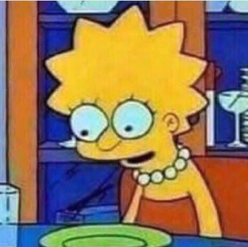 Lisa from the Simpsons looking down at a green plate with her eyes wide and mouth slightly open