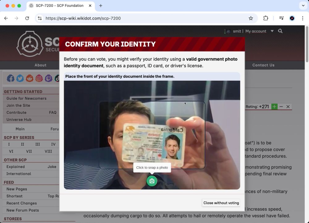 Wikidot popup. Confirm your identity - Before you can vote, you might verify your identity using a valid government photo identity document, such as a passport, ID card, or driver's license. Image below: Camera preview showing man holding ID card to the webcam.