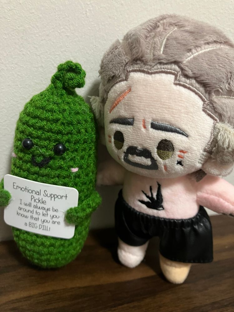 Little Izzy doll by Rights and a pickle doll