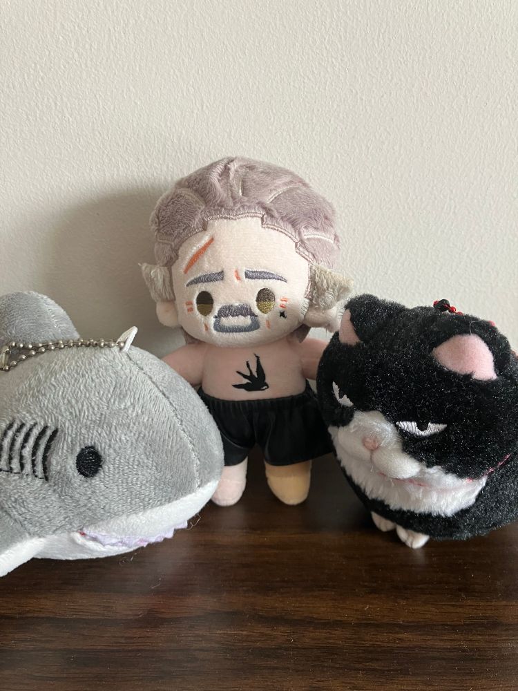 Little Izzy doll by Rights with a shark and a tuxedo cat plushie
