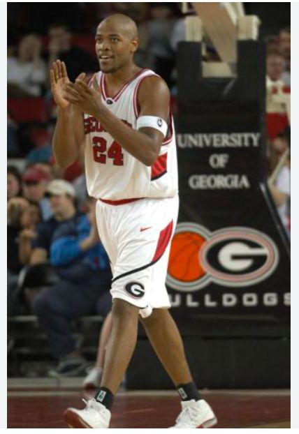 Jarvis Hayes in his IGA basketball uniform clapping