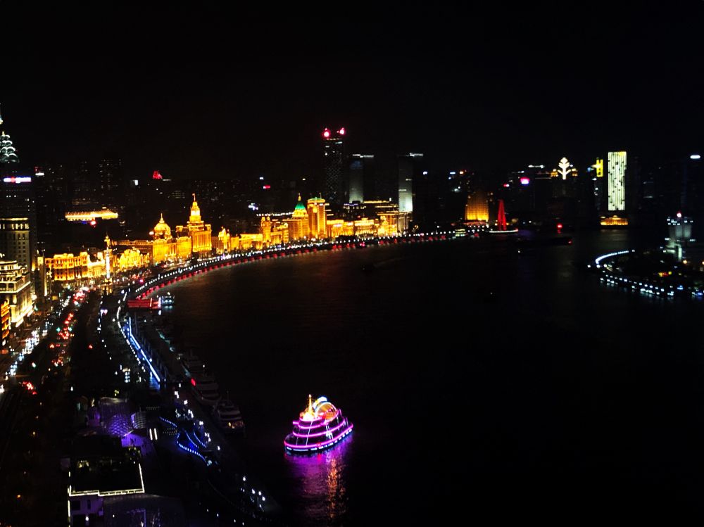 Looking down at the Bund, city lights along the Huangpu River. Photo taken from 40 floors above. 