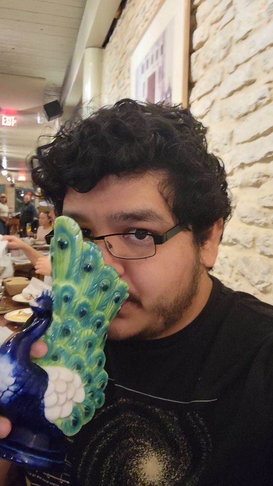 Me drinking from the peacock cup