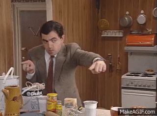 Mr Bean measuring a distance with his fingers instead of a ruler
