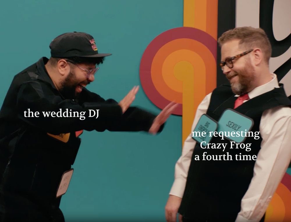 Sam Reich sexily approaching Oscar Montaya, as Oscar puts his arms out, laughing, trying to get him away. Oscar is labeled 'the wedding DJ' and Sam is labeled 'me requesting Crazy Frog a fourth time'.