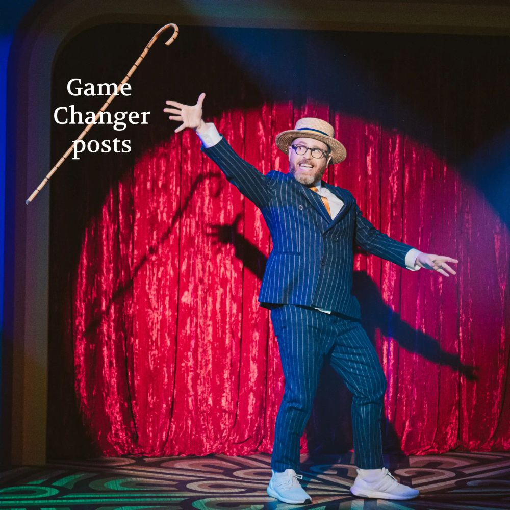 Sam dancing in a spotlight, tossing a cane with text over it labeled "Game Changer posts." Photo by Kate Elliot.