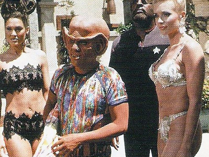 Quark with two scantily-clad women on the Ba'ku planet.