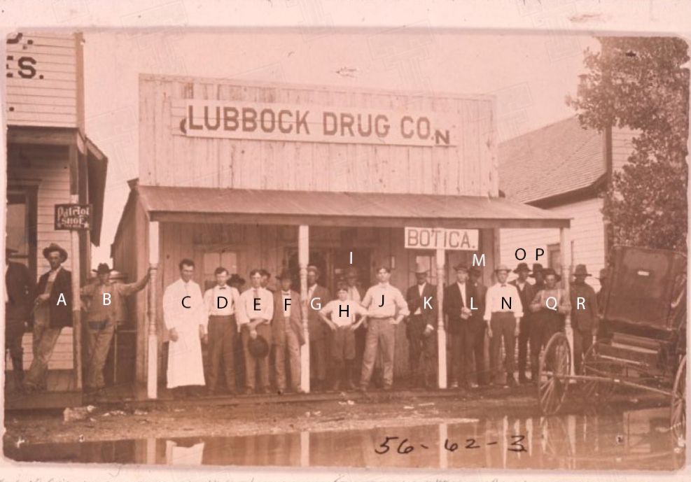 Lubbock Drug Co., and people in front of building.