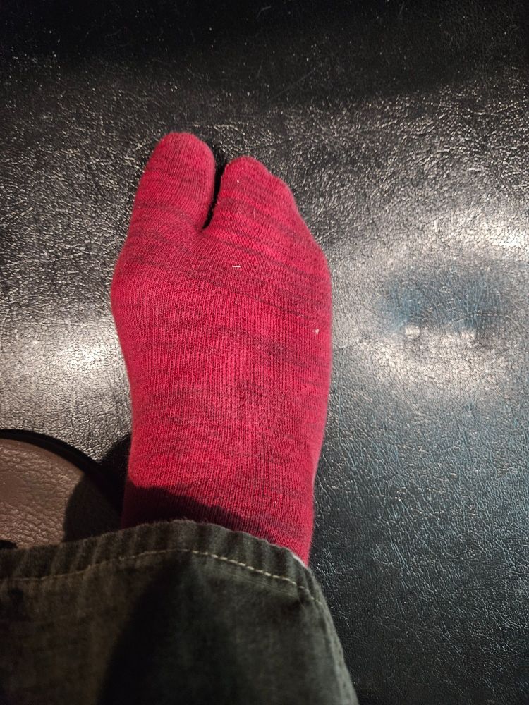 A photo of my foot, in a red tabi sock. 