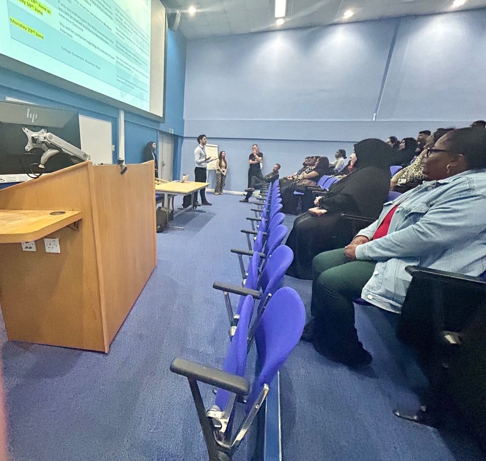Group in lecture theatre listening to a talk