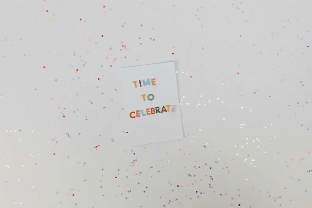 Decorative image with Time to Celebrate message on a glittery background