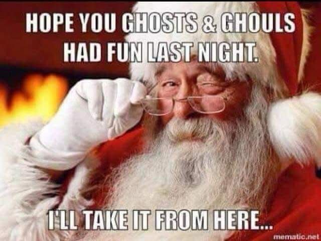 Santa Claus winks and holds his glasses with the text: "Hope you ghosts & ghouls had fun last night. I'll take it from here." Fireplace in the background.