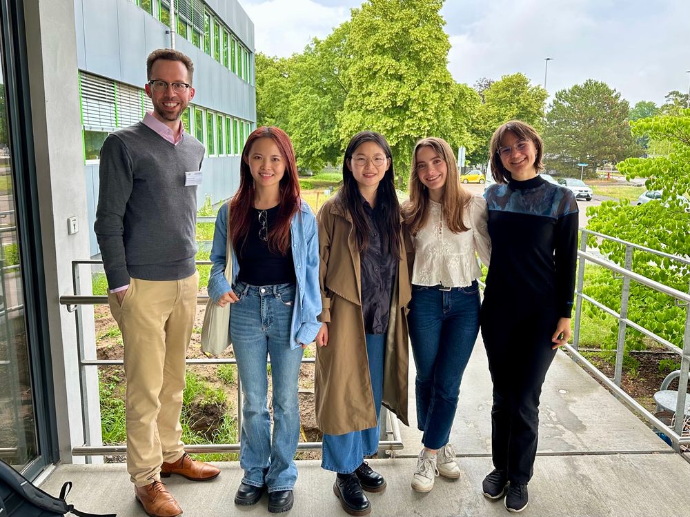 A photo of Volker, Litong, Shixuan, Natascia, and Bianca outside a building at KIT where the workshop was held