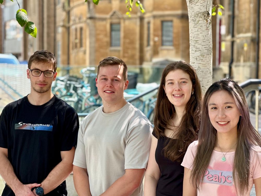 A photo of Georgi, Arun, Johana, and Cecilia, taken outdoors on a sunny day