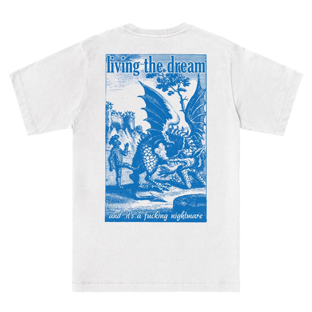 A white t shirt from the back, the back print is a gravure/etching style illustration of a knight kicking a dragon. The text reads:
“Living the dream 


And it’s a fucking nightmare”